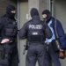 FILE - Police investigates in Duesseldorf, Germany, as part of raids in severals German cities, Wednesday, Oct. 6, 2021. Germany’s overall crime rate continues to decline, but the country has seen a steep increase in the distribution of child pornography and cybercrime. (AP Photo/Martin Meissner, File)