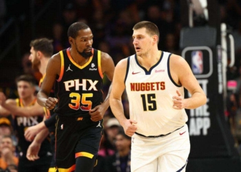 Dec 1, 2023; Phoenix, Arizona, USA; Phoenix Suns forward Kevin Durant (35) against Denver Nuggets center Nikola Jokic (15) in the first half at Footprint Center. Mandatory Credit: Mark J. Rebilas-USA TODAY Sports