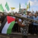 A supporter of the Lebanese Islamic group and the Islamist Hamas movement holds a mock rocket as he attends with other supporters a protest to condemn the killing of Hamas political chief Ismail Haniyeh, Wednesday, July 31, 2024, in the southern port city of Sidon, Lebanon. Two back-to-back strikes in Beirut and Tehran, both attributed to Israel and targeting high-ranking figures in Hezbollah and Hamas, have left Hezbollah and Iran in a quandary. (AP Photo/Mohammed Zaatari)