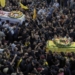 Mourners carry the coffins of victims who were killed Tuesday after their handheld pagers exploded, during their funeral procession in the southern suburb of Beirut, Lebanon, Wednesday, Sept. 18, 2024. (AP Photo/Bilal Hussein)
