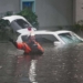 First responders in the water outside an apartment complex that was flooded from and overflowing creek due to Hurricane Milton on October 10, 2024 in Clearwater, Florida. At least four people were confirmed killed as a result of two tornadoes triggered by Hurricane Milton on the east coast of the US state of Florida, local authorities said Thursday. (Photo by Bryan R. SMITH / AFP)