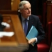French Prime Minister Michel Barnier prepares to deliver a speech during the debate prior to the no-confidence votes on his administration at the National Assembly in Paris on December 4, 2024. The French National Assembly debates two motions brought by the French left-wing Nouveau Front Populaire (New Popular Front) NFP coalition and the French far-right Rassemblement National (National Rally) RN party in a standoff over 2025's austerity budget, which saw French Prime Minister force through a social security financing bill without a vote (article 49.3) on December 2, 2024. (Photo by Alain JOCARD / AFP)